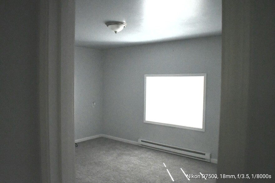Entrance to front bedroom off main living space. - 77 Fox St