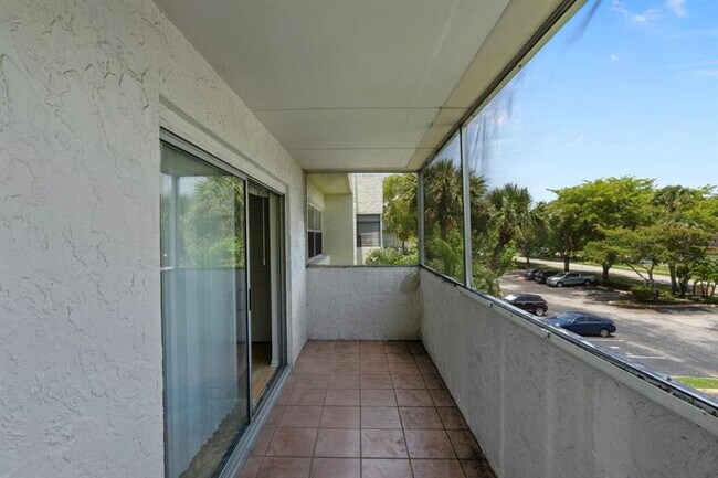 Building Photo - 6075 N Sabal Palm Blvd