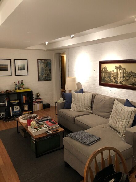 large living room with exposed brick walls - 2434 N. Orchard St.