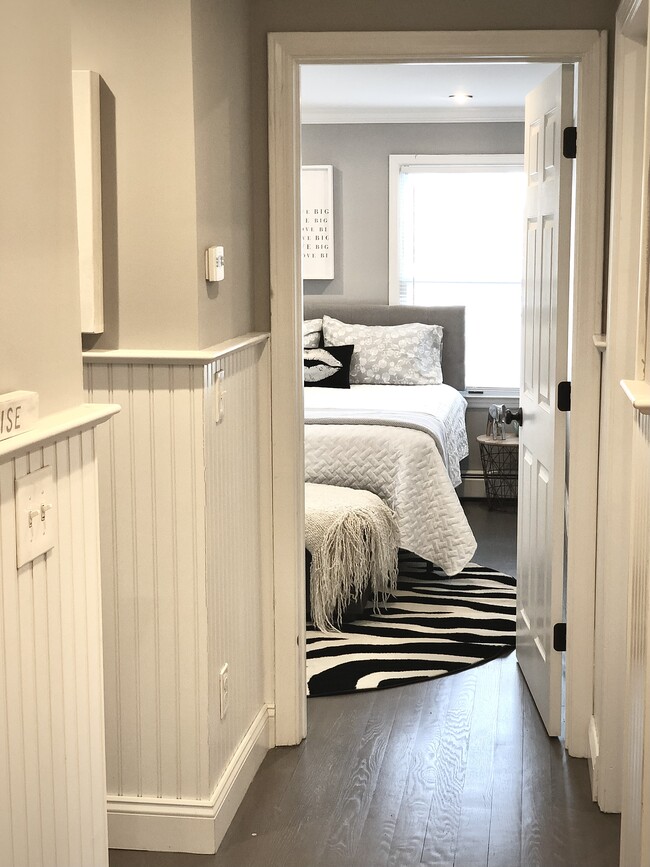 Bedroom 2 (Queen) - Beach views with closet and chair - 840 E Broadway