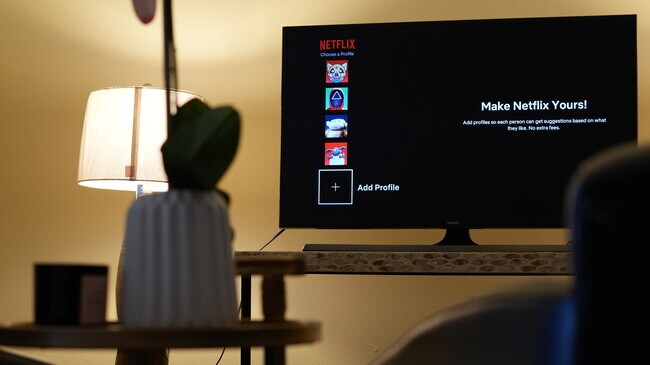 A smart TV is located in the living room that includes apps Netflix, Amazon Prime Video, and Hulu. - 4160 Barrett Rd