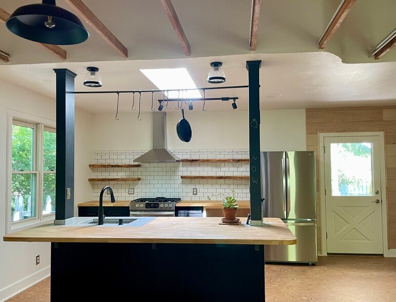 kitchen island, hand forged custom pot rack - 6605 Shady Lake Ln