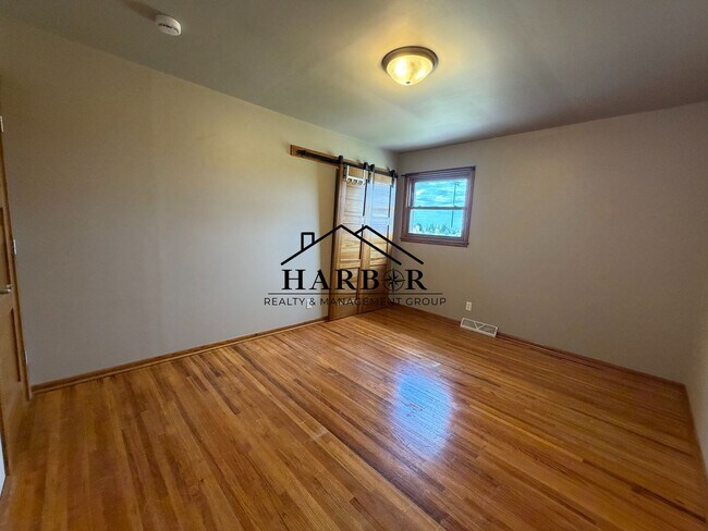 Building Photo - *1/2 Off First Months Rent* Spacious 3BR Home with 2-Stall Garage & Private Deck in Kasson