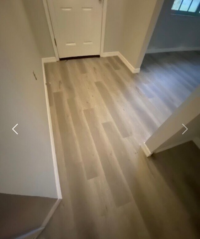 Building Photo - Available NOW! NEW FLOORS AND PAINT! Lovely 3/2 in Poinciana! HUGE fenced yard and NO CARPET!