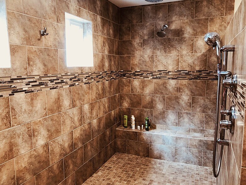 Main bedroom shower with multiple heads. - 7107 120th St NW