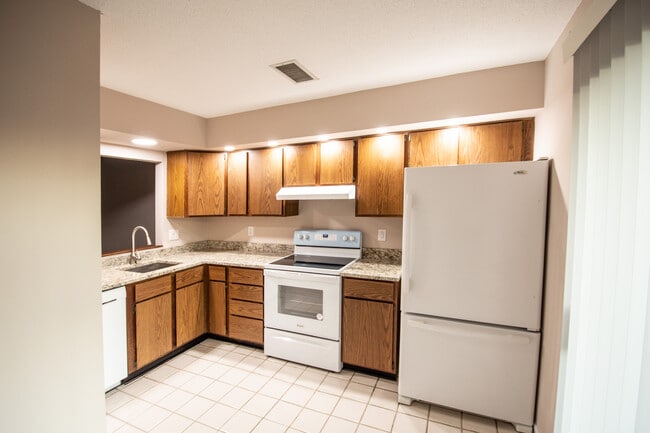 Kitchen with tile floor and granite countertops - 115 Beechnut St
