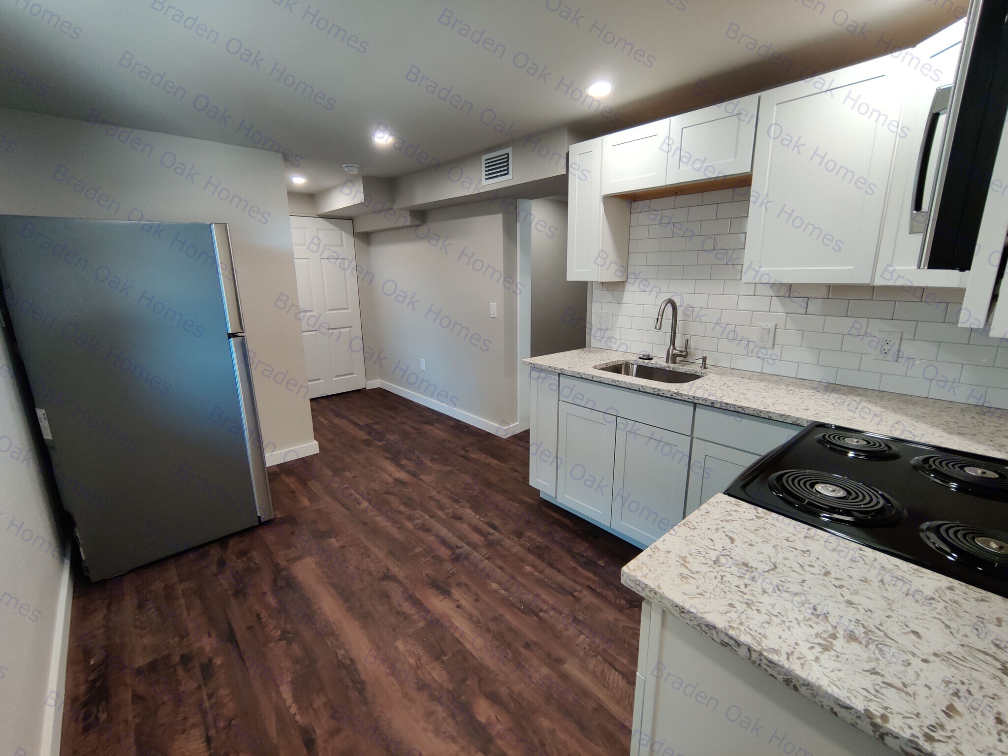 Modern Kitchen w/ stainless steel appliances, granite countertops, garbage disposal - 1814 26th St W