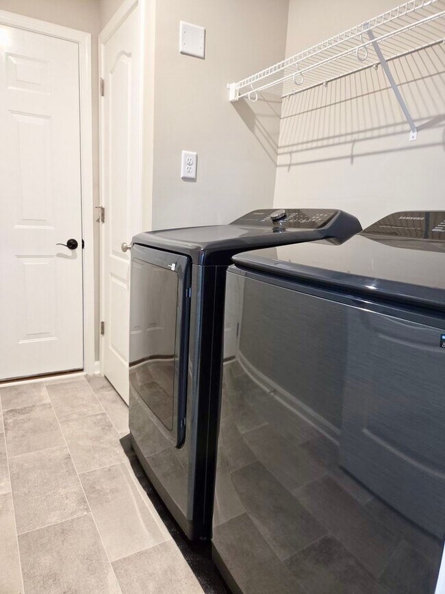 Building Photo - Exquisite just built condo with everything! Ground floor, no stairs, attached garage