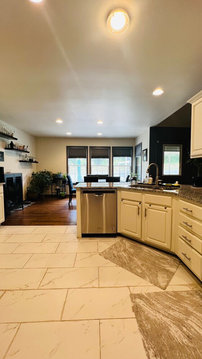 Open kitchen/dining space with wall of windows - 159 Brookview Cir