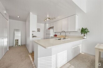 Building Photo - Thoughtfully Remodeled Condo W/ Attached G...