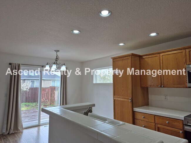 Building Photo - Bethany 3 Bed + Office on Main Fenced Back Yard w/Deck 2 Car Attached Garage Available Now!