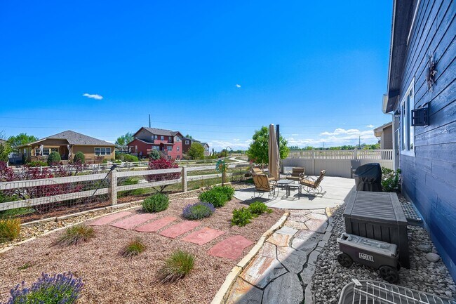 Building Photo - Stunning & Contemporary 4-Bedroom Home on Open Space-Available July 1st!
