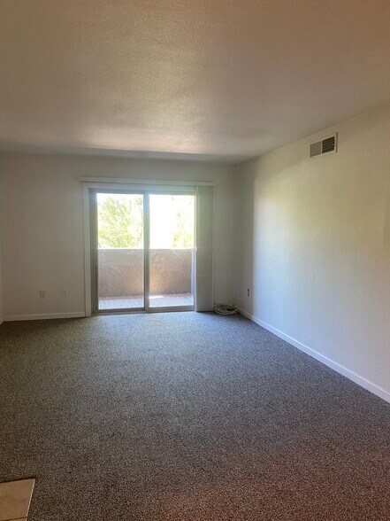 Spacious, open living area. South-facing patio. - 5877 N Granite Reef Rd