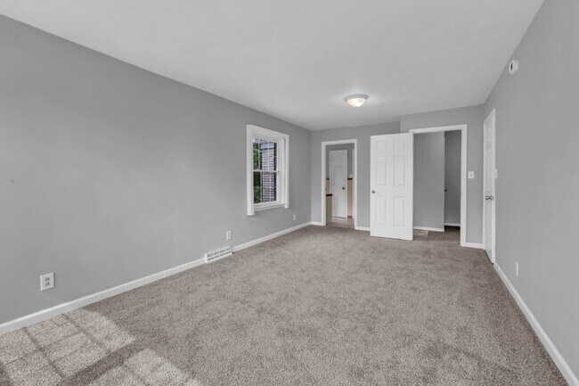 Building Photo - spacious 4-bedroom, 2.5-bath home featuring a 2-car garage and fresh updates throughout.