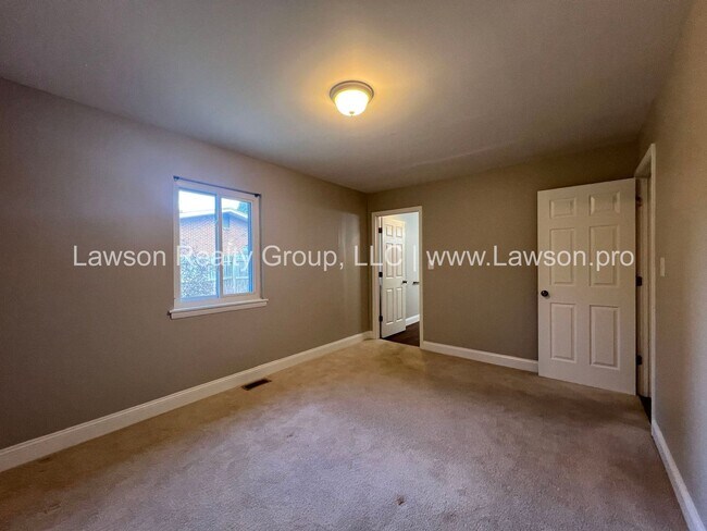 Building Photo - One Level Living- Beautifully Landscaped Yard and Attached Carport