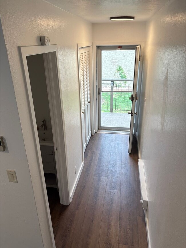 Building Photo - Completely Renovated 2 Bed 1.5 Bath West Pearl Street Condo W/Hiking Trails In Your Backyard.