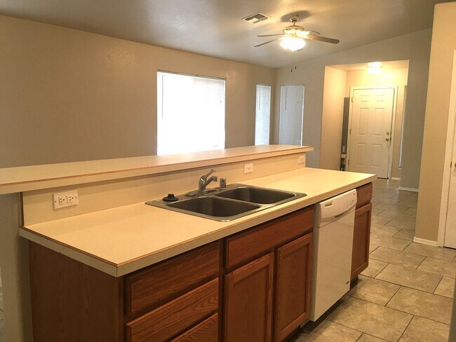 Building Photo - 3-Bedroom Single Family Home with Central Cooling, Attached Garage, and Tile Flooring