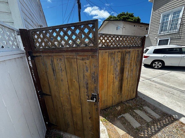 Laundry room located in building where the white car is parked - 1814 Pacific Beach Dr