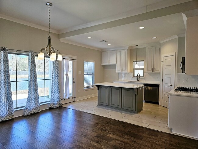 Building Photo - Stunning 4-Bedroom Waterfront Home with Granite Countertops and Hardwood Floors in The Sanctuary ...