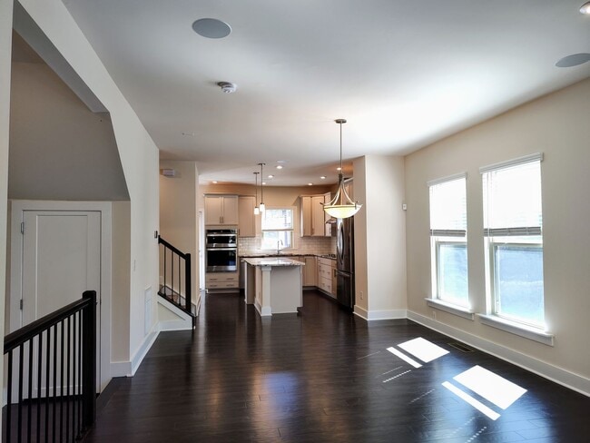 Building Photo - Modern End-Unit Townhome located in the Ce...