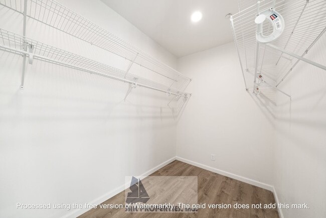 Building Photo - Welcome to this stunning 2-bedroom condo in gated community