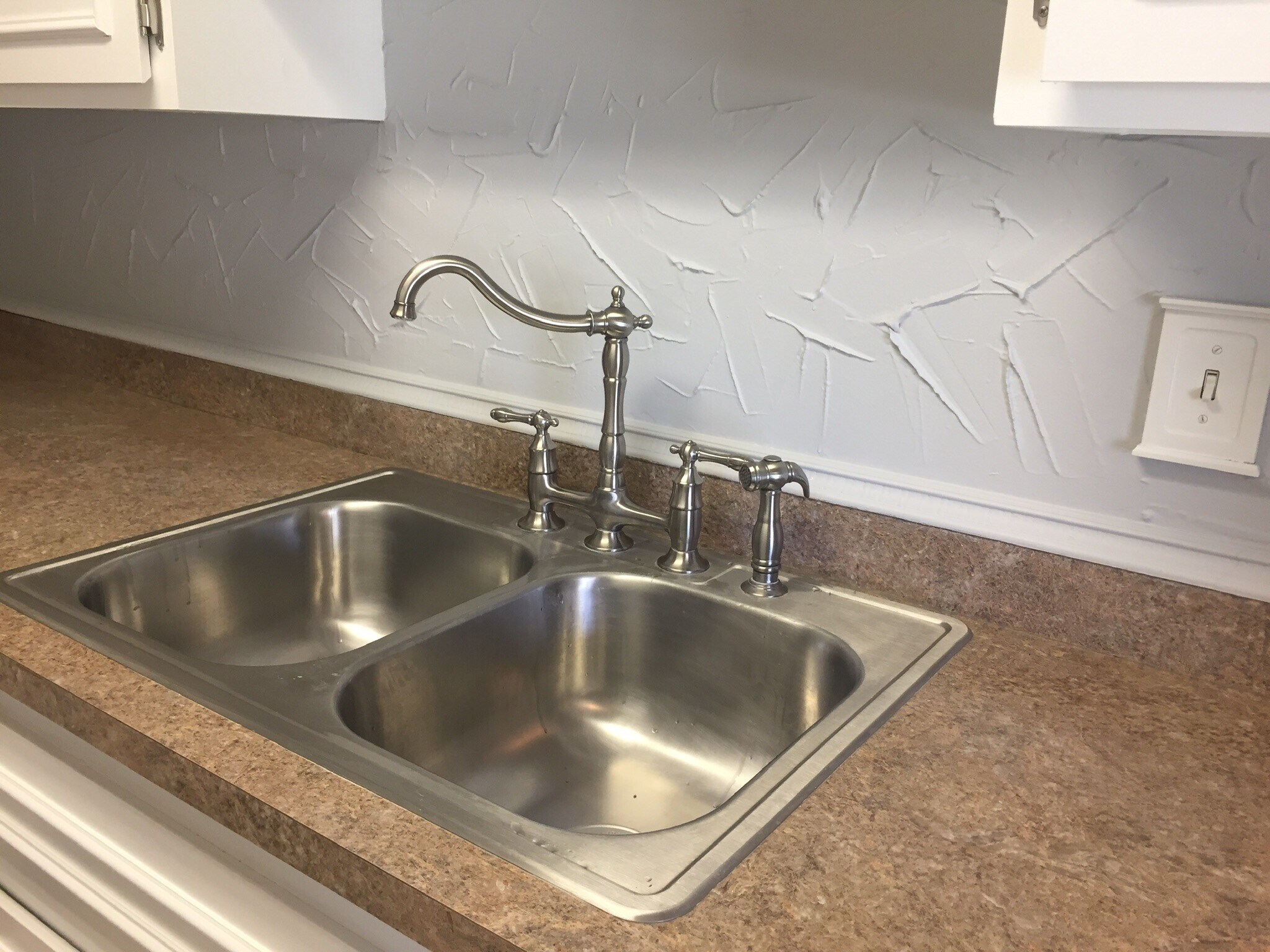 Newer Bridge faucet in double sink - 1814 Colonial Village Way