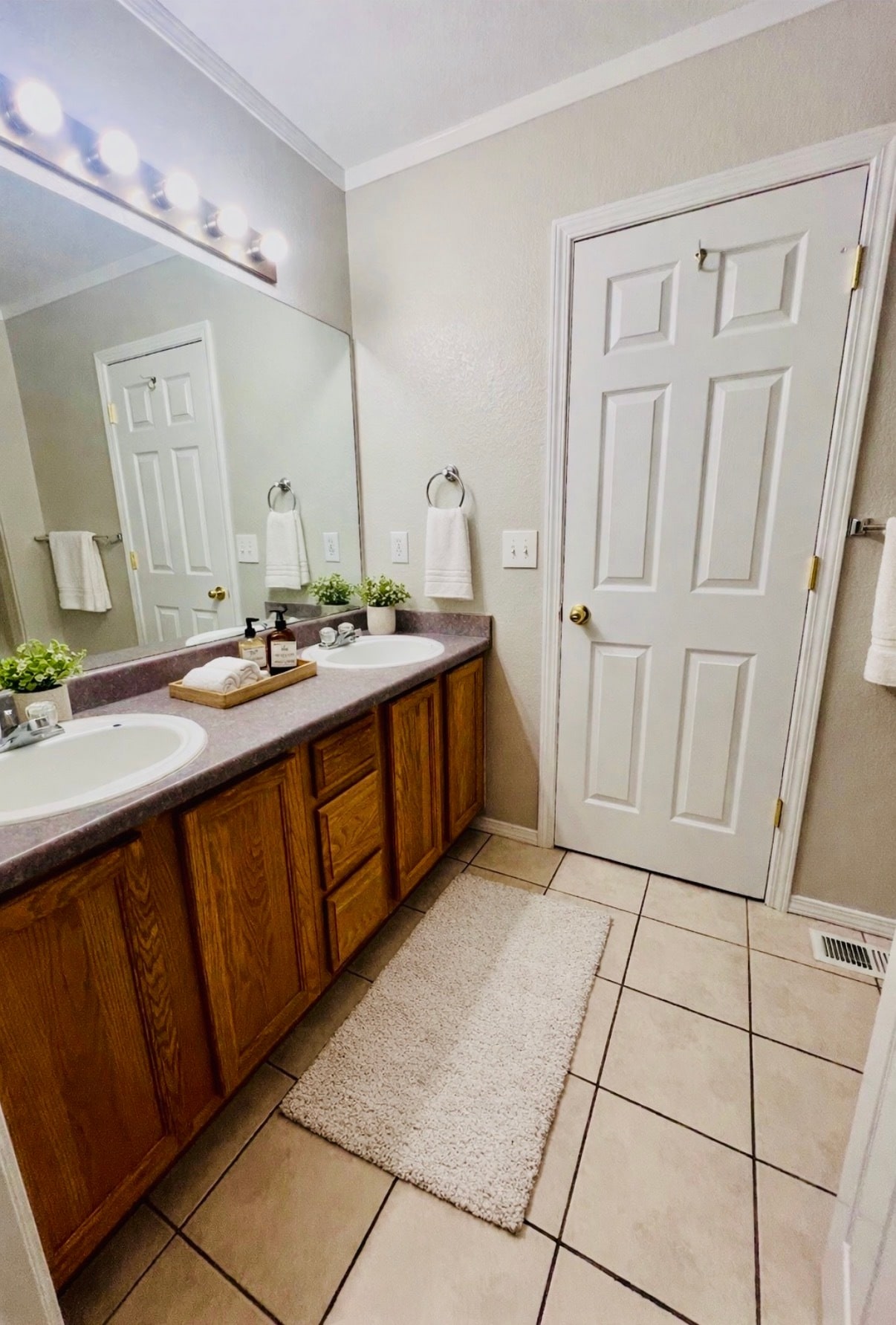 Upstairs Jack-and-Jill style bathroom vanity, virtually staged with decor only - 2563 Malpaso Pt