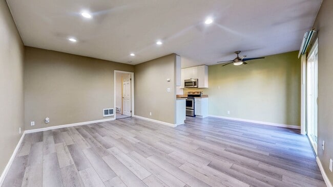 Building Photo - Cozy 1 bedroom 1 bath end unit condo with 1 car garage and private patio located next to Peterson...