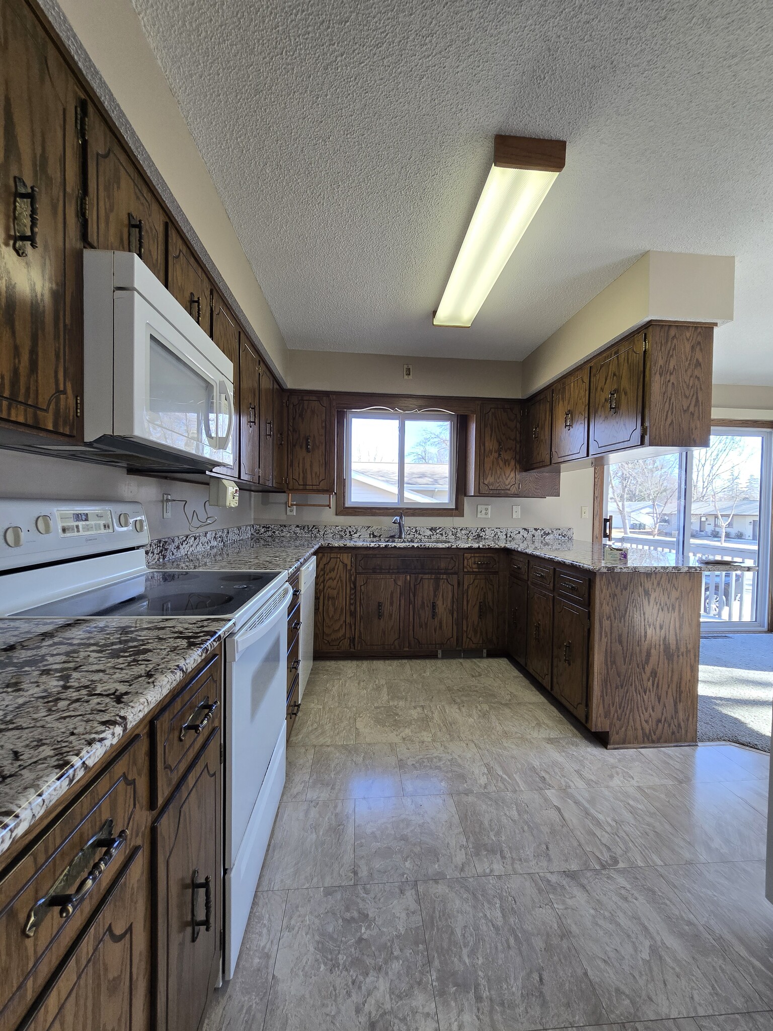 Kitchen with dishwasher and updated appliances - 775 Madson Ave SW