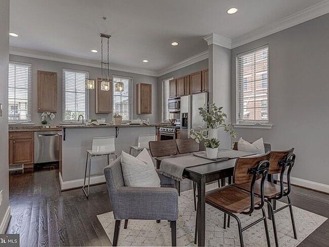 Building Photo - Beautiful EOG 3 bedroom  2.5 bath townhome with a 2 car garage and roof top deck overlooking the ...