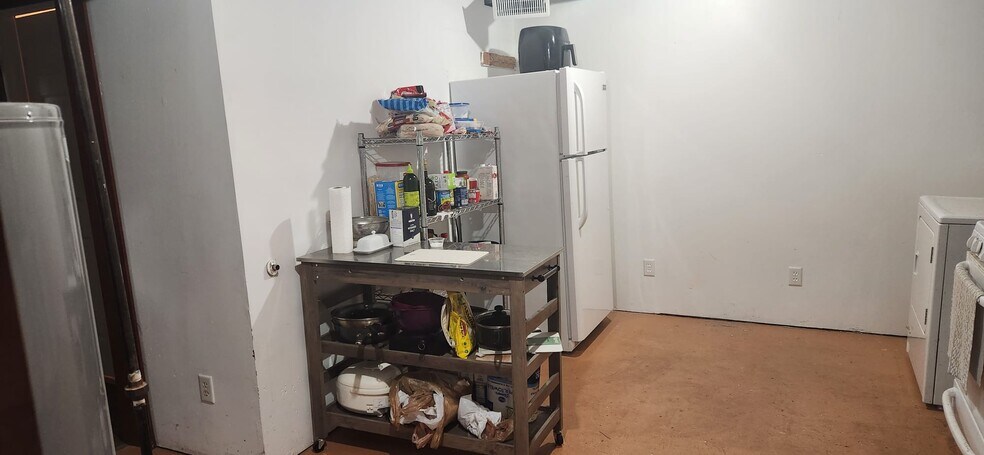 Kitchen/laundryroom - fridge - 2116 Thaler Ave