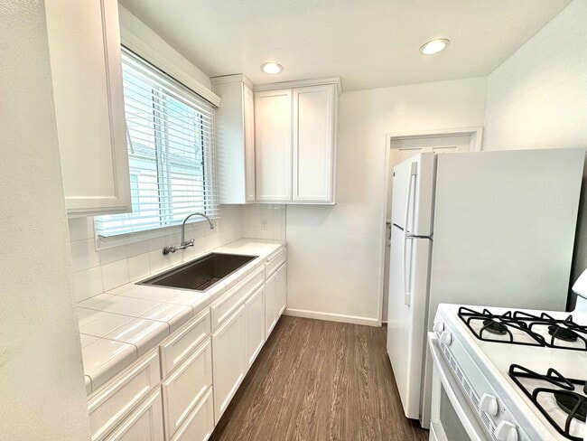 Building Photo - An apartment with character! Hardwood floo...