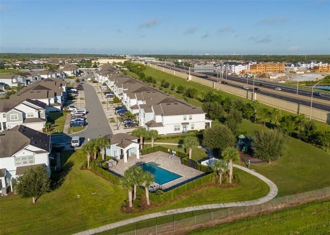 Building Photo - Immaculate Townhome · Dual En-Suite Bedrooms + Flex Loft · Cable & Internet Included · 3.5 Miles ...