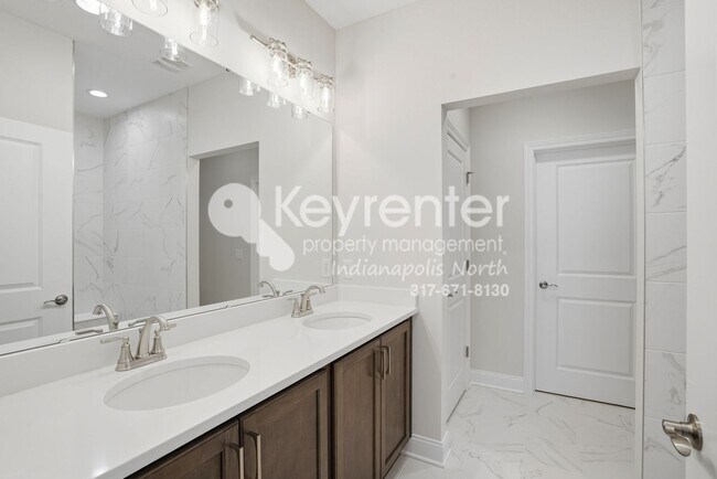 Building Photo - Located in Westfield, IN, this attractive 3-bedroom, 2.5-bath home sits on a corner lot within an...