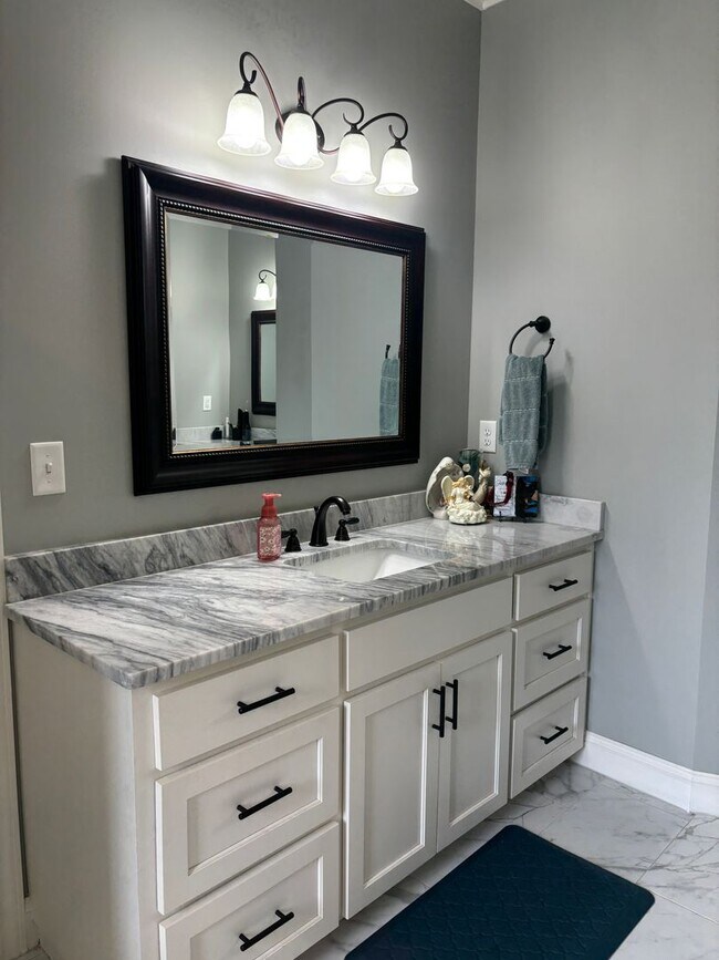 Building Photo - Spacious 4BR/3BA Creekside West Home with Screened Porch, Fenced Yard & 3-Car Garage