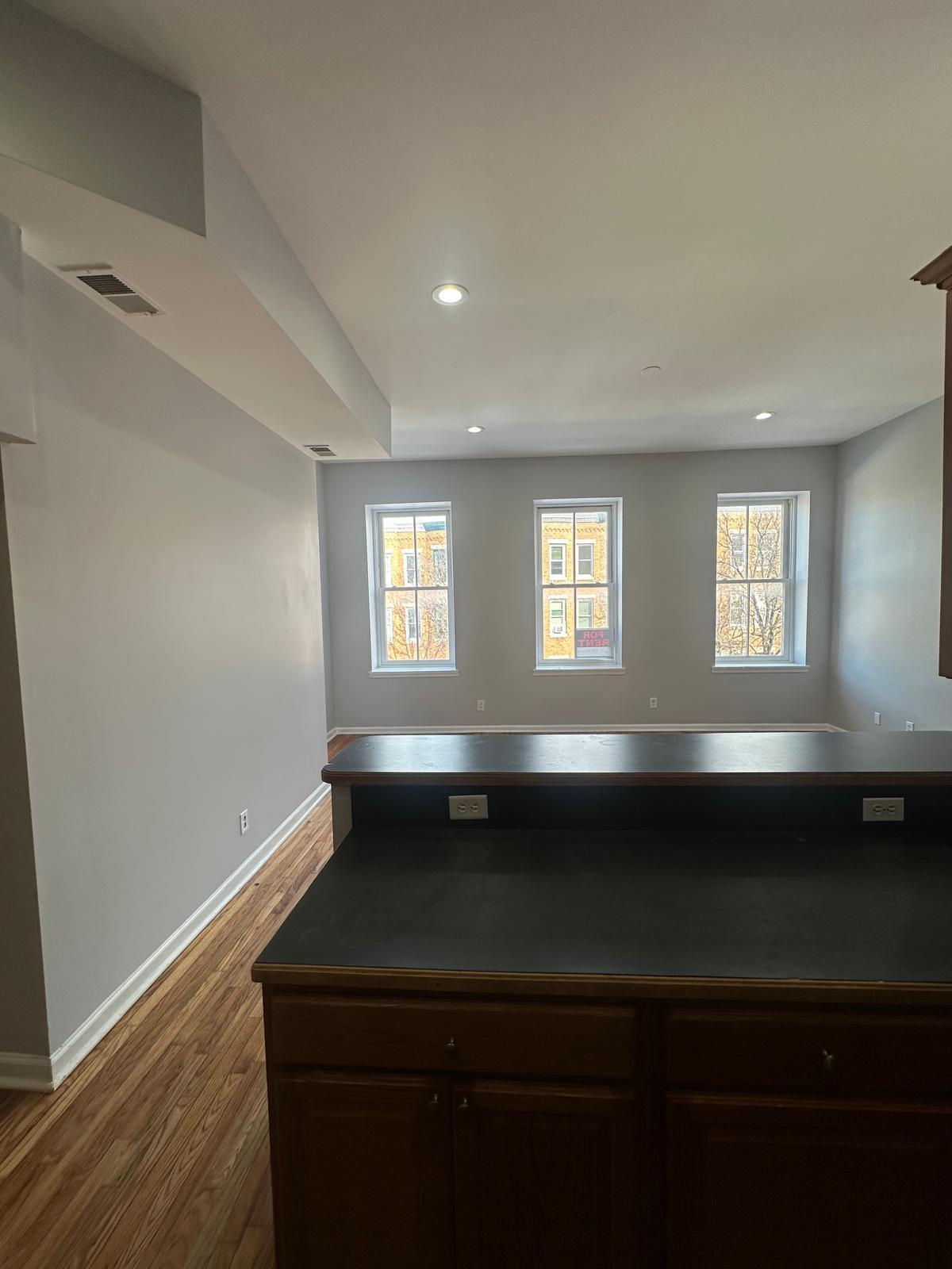 Large living/dining room windows gives good natural light into the living and dining room & kitchen - 1426 Madison Ave