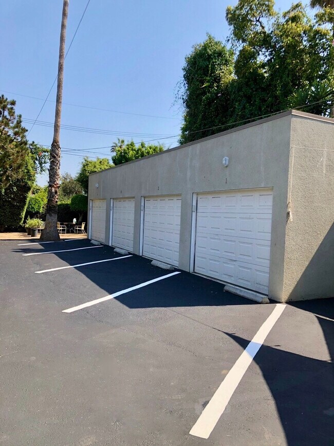 Open assigned parking spaces, - 12946 Walsh Ave