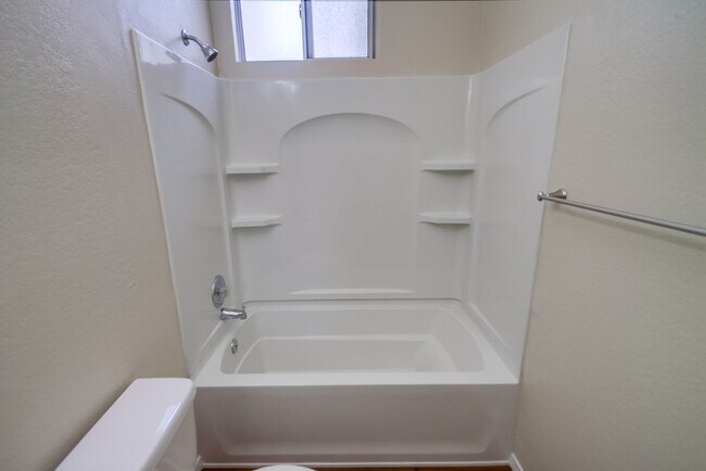 Building Photo - Spacious Townhome in San Marcos, 2-Car Garage, and a Tropical Community Pool!!
