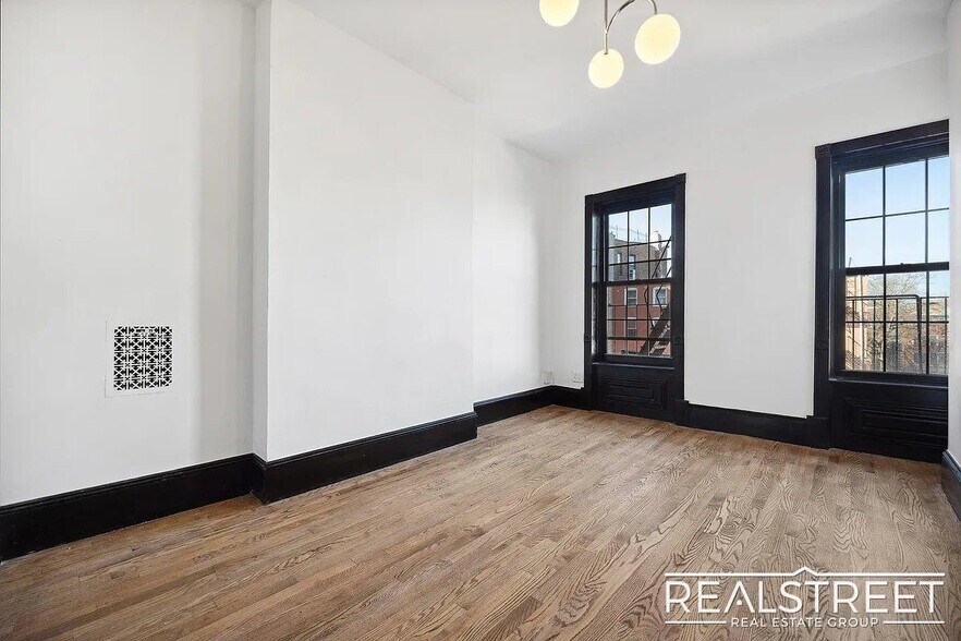 Building Photo - Timelessly Renovated Historic Triplex with...