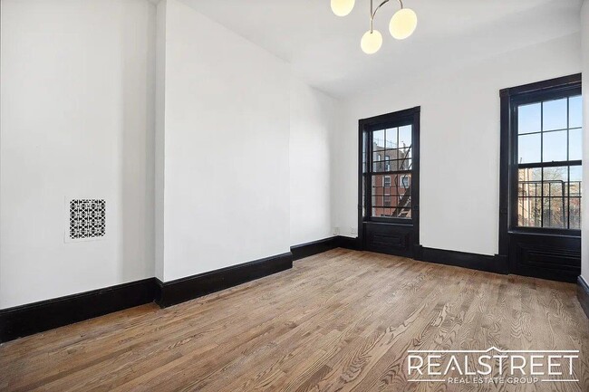 Building Photo - Timelessly Renovated Historic Triplex with...