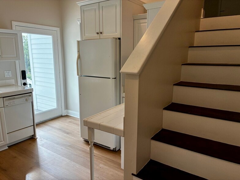 Kitchen & stairs to leading up to living room, bathroom & bedroom - 649 Crest Dr