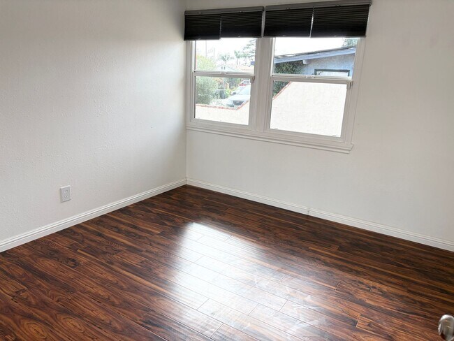 Building Photo - Beautifully Maintained 4-Bedroom Home with Private Backyard