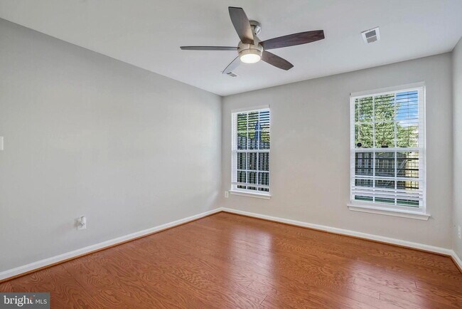 Building Photo - This beautifully maintained brick-front, three-level townhome is located in a highly sought-after...