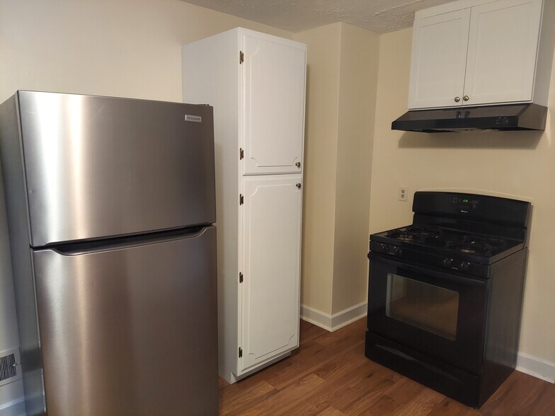 Newer appliance and plenty of storage. Floors are LVP for worry-free cleanup. - 1201 N Madison St