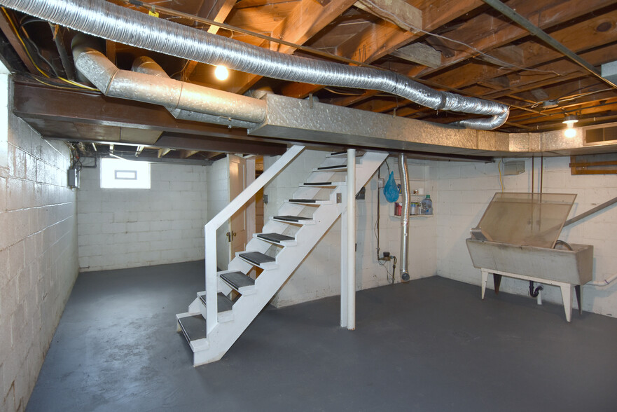 Spacious basement with private laundry area and washer/dryer hookups. - 31 Marylea Ave