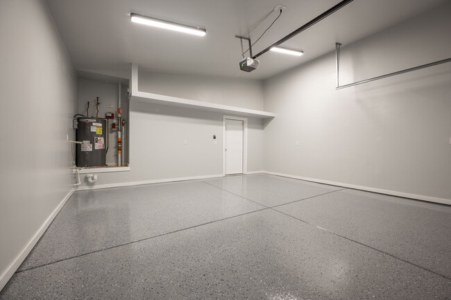 Finished garage floor with storage shelvings - 4358 Capistrano Ave