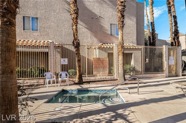 Building Photo - INVITING 2 BEDROOM TOP FLOOR CONDO IN A CE...