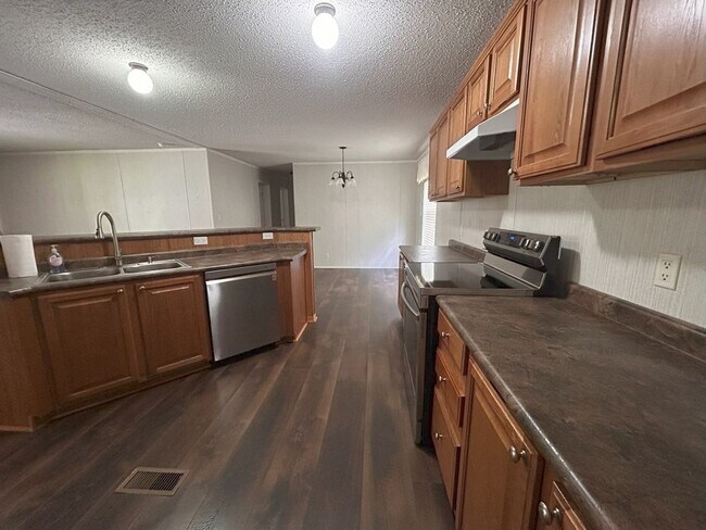 Building Photo - Immaculate 4BR Mobile Home in the heart of...
