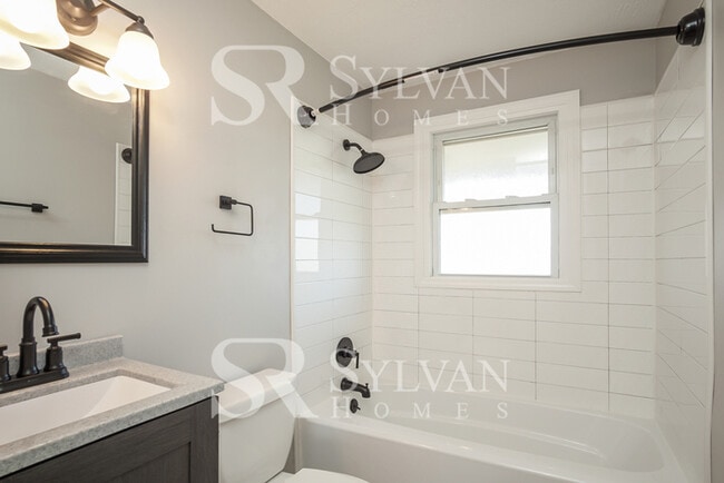 Building Photo - This home exudes a cheerful and welcoming charm!