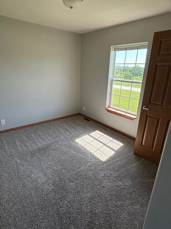 Building Photo - Fully Remodeled 3 Bedroom | 2.5 Bath Townhome – Great Location off K-18!